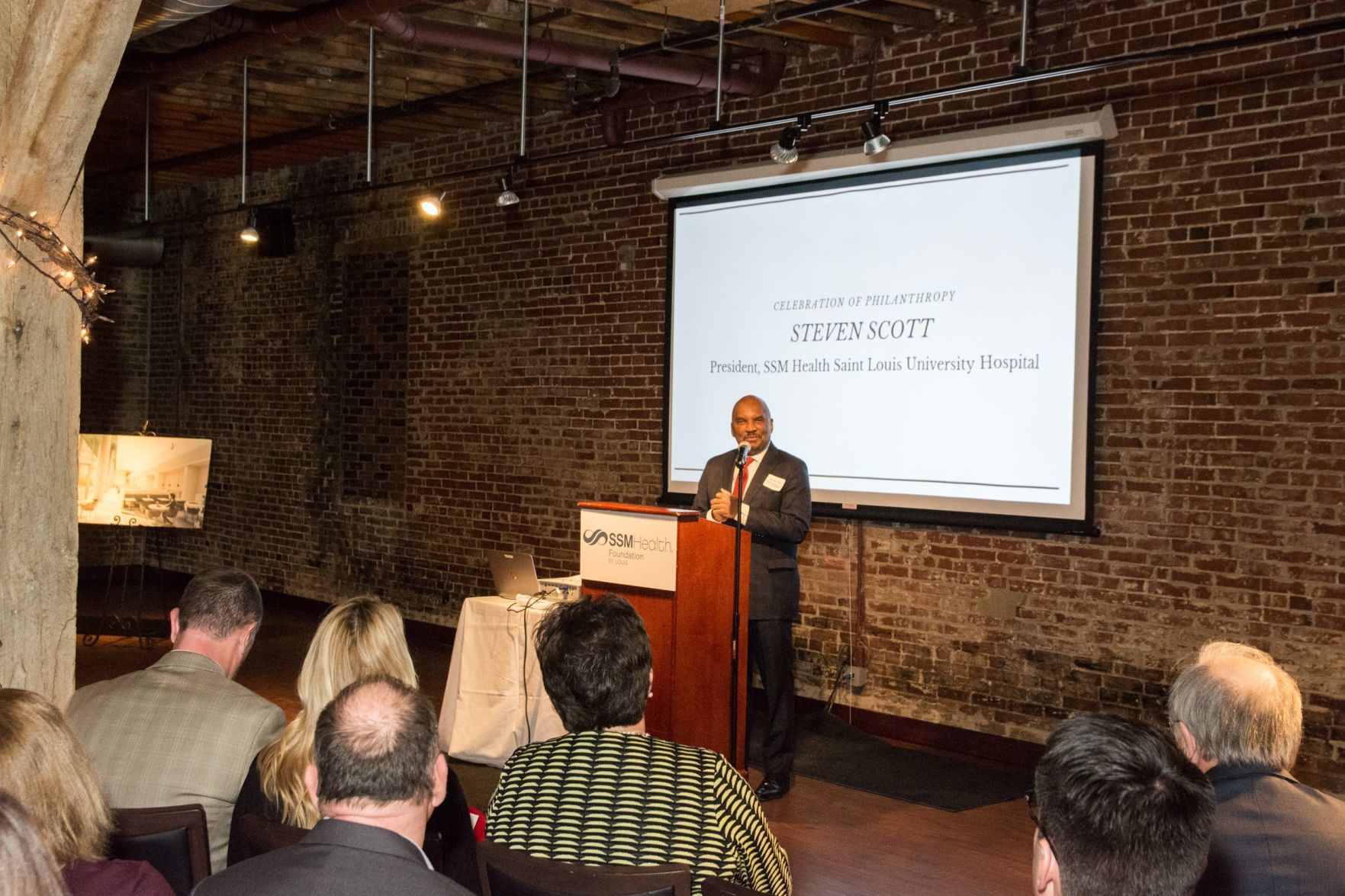 Steven Scott, President of SSM Health Saint Louis University Hospital speaks at the event